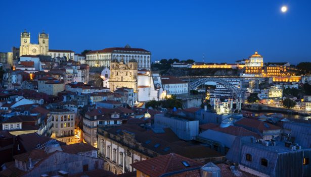 Famous view of Porto by night with moon, Portugal, Europe